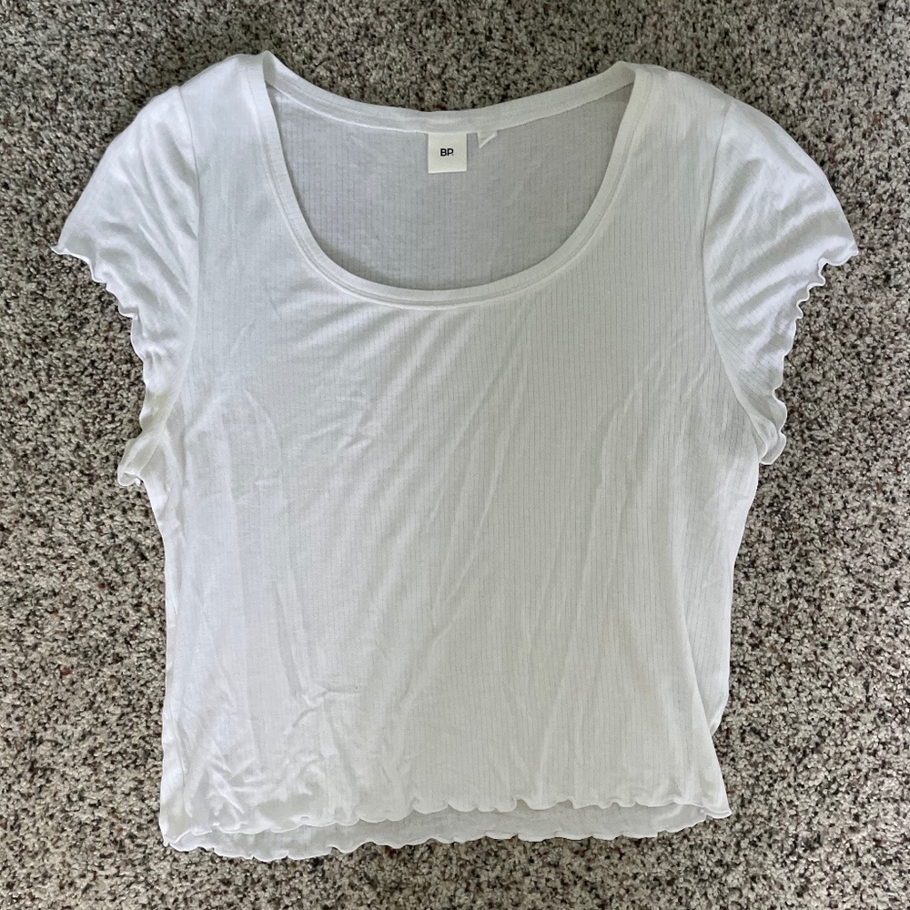 White shirt with sleeve and bottom detailing